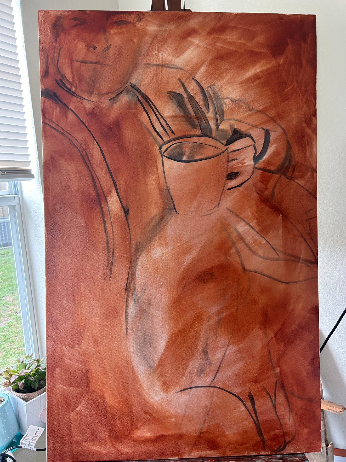 Canvas toned wit paint and a crude drawing of a man